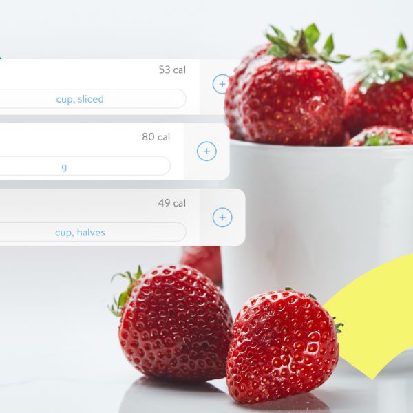 A cup of strawberries with pop-ups of different serving size options from the Trainerize in-app meal tracker.